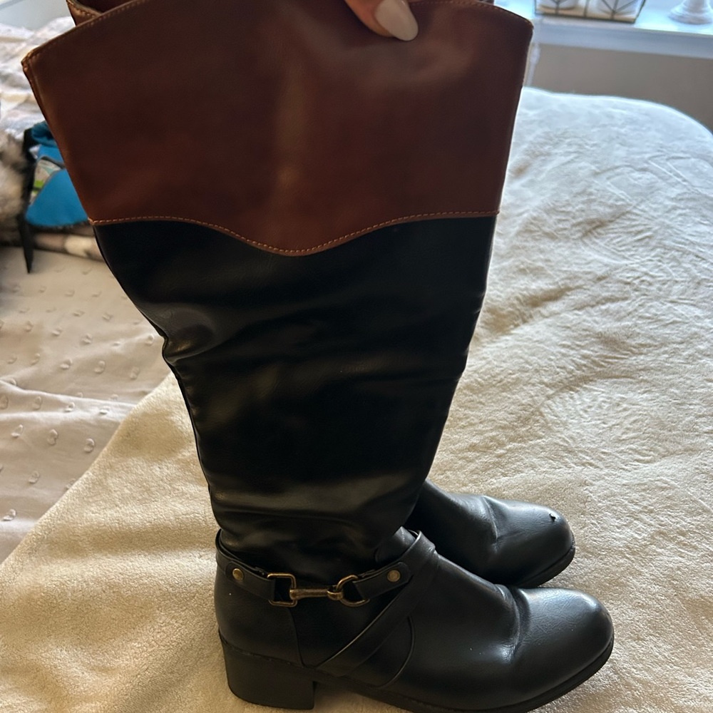 Black and brown tall riding boots